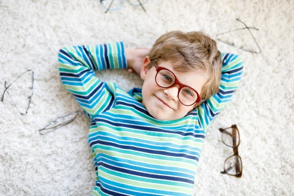 Close-up portrait of little blond kid boy with brown eyeglasses — Stock Photo, Image