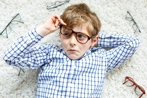 Close-up portrait of little blond kid boy with brown eyeglasses — Stock Photo, Image