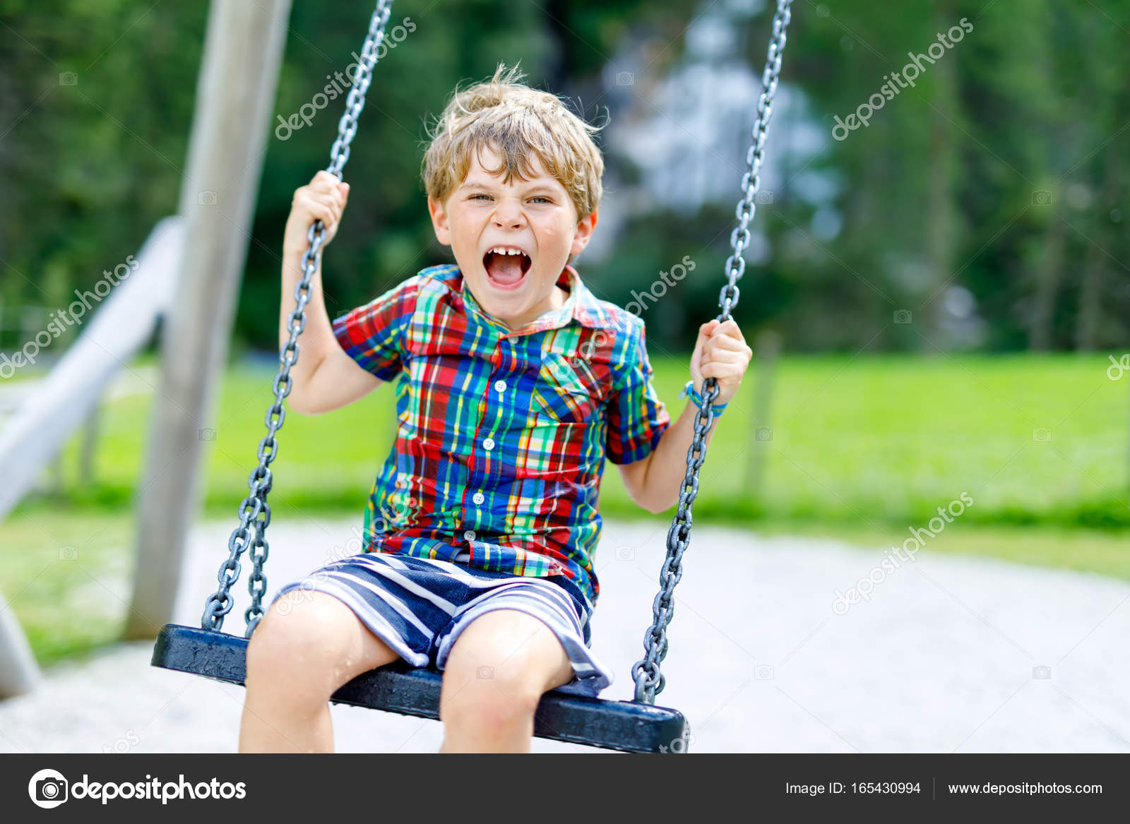 Funny kid boy having fun with chain swing on outdoor playground on sunny day Stock Photo by ©romrodinka 165430994 Funny kid boy having fun with chain swing on outdoor playground on sunny day Stock Photo by ©romrodinka 165430994