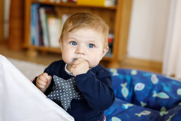 Cute baby girl playing with colorful soft toy — Stock Photo, Image