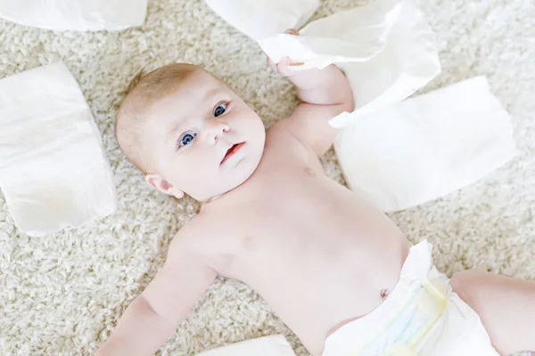 Newborn baby girl with diapers. Dry skin and nursery — Stock Photo, Image