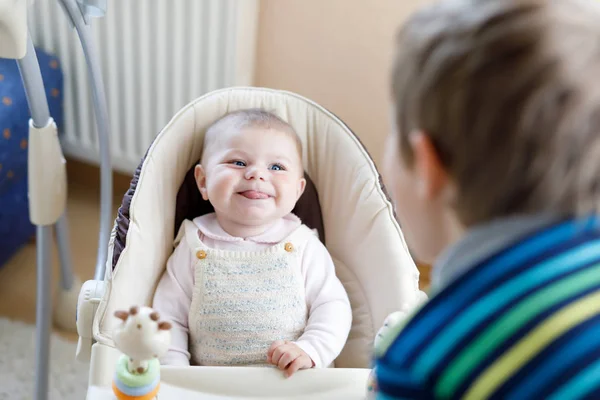 Happy little kid boy with newborn baby sister girl — Stock Photo, Image