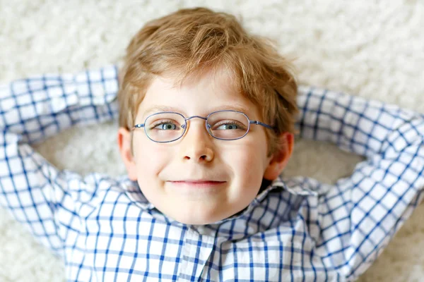 Close-up portrait of little blond kid boy with brown eyeglasses — Stock Photo, Image