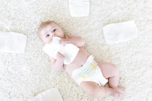Newborn baby girl with diapers. Dry skin and nursery — Stock Photo, Image