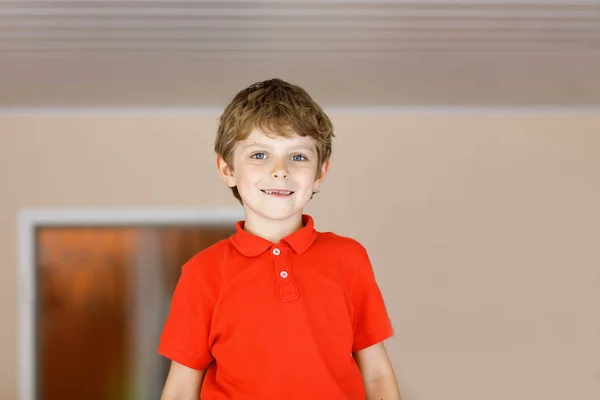 Portrait of little cute school kid boy in colorful school uniform fashion clothes with missing front teeth — Stock Photo, Image