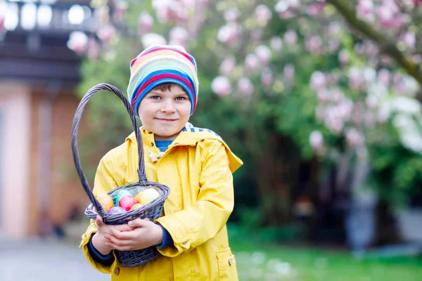 Cute adorable little kid boy making an egg hunt on Easter. — Stock Photo, Image