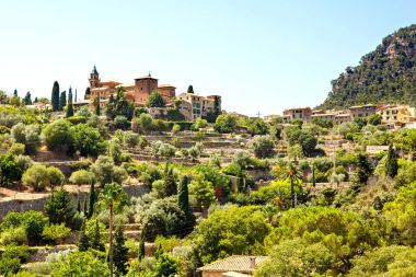 View on city Valldemossa with traditional flower decoration, famous old mediterranean village of Majorca. Balearic island Mallorca, Spain clipart