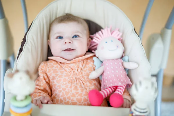 Cute adorable newborn baby sitting in swing — Stock Photo, Image