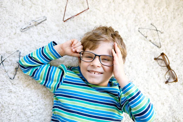 Close-up portrait of little blond kid boy with brown eyeglasses — Stock Photo, Image