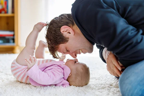 Happy proud young father with newborn baby daughter, family portrait together — Stock Photo, Image