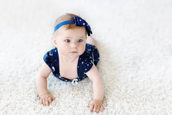 Cute adorable baby girl in blue clothes and headband. — Stock Photo, Image