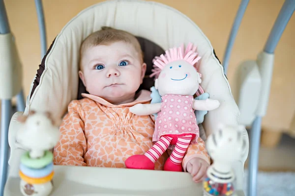 Cute adorable newborn baby sitting in swing — Stock Photo, Image