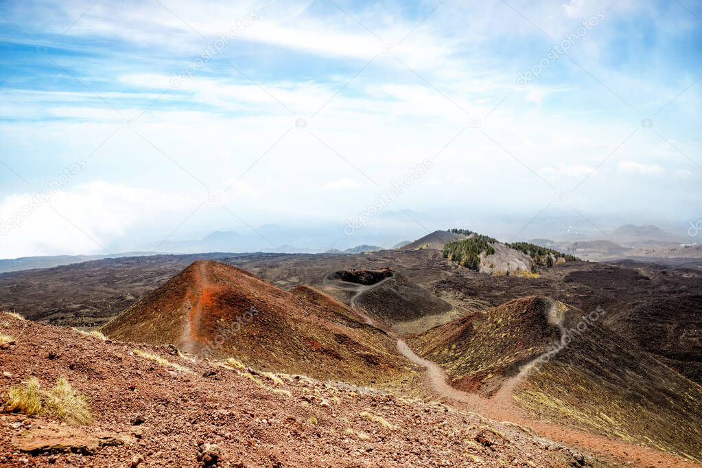 Panoramic wide view of the active volcano Etna on island Sicily, Italy extinct craters on the slope, traces of volcanic activity. Barren landscape of lava stones