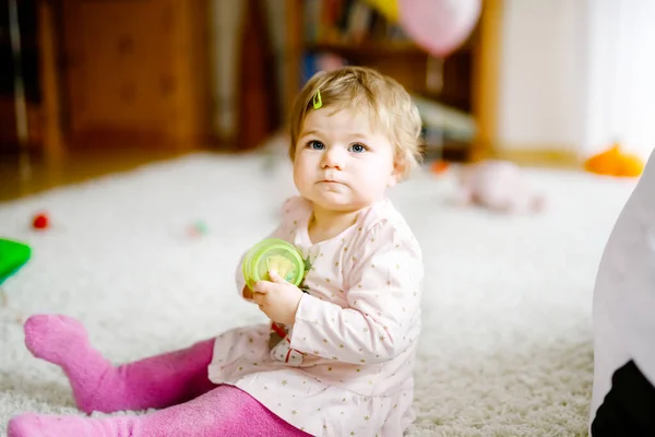 Lovely cute beautiful little baby girl playing with educational toys at home or nursery. Happy healthy child having fun with colorful different toys. Toddler learning different skills — Stock Photo, Image