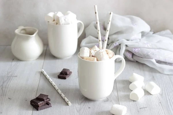 White Cup of hot chocolate drink with marshmallows and cinnamon. Winter time. Holiday concept. Selective focus — Stock Photo, Image