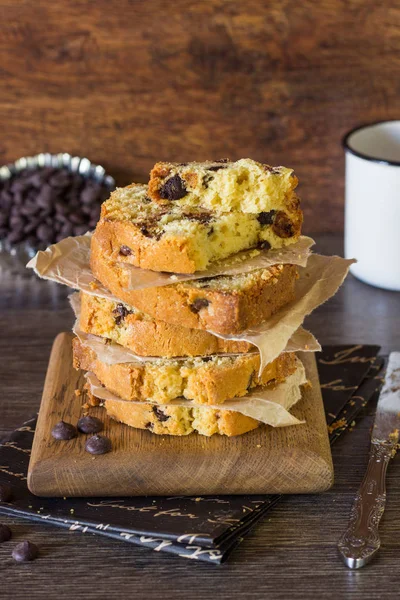 Pound chocolate drops cake piece stack on a wooden board