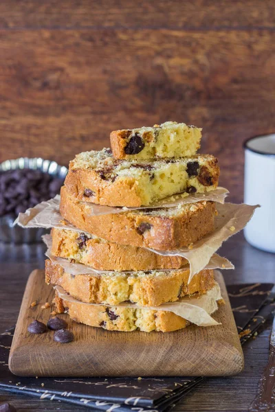 Pound chocolate drops cake piece stack on a wooden board