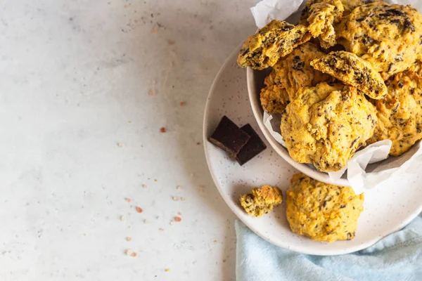 Freshly baked pumpkin cookies with oatmeal and chocolate chips. Healthy snack for breakfast. Fall pumpkin cookies.