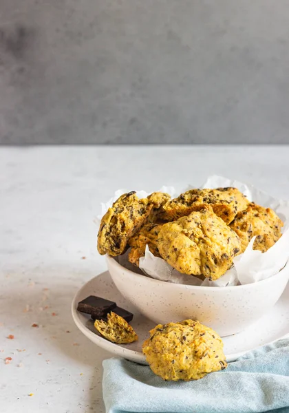 Freshly baked pumpkin cookies with oatmeal and chocolate chips. Healthy snack for breakfast. Fall pumpkin cookies.