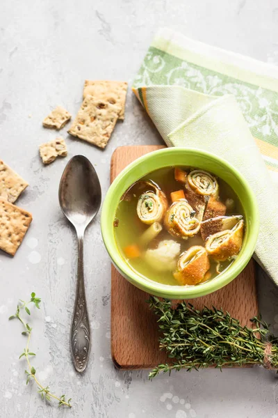 Vegetable soup with egg pancakes on light grey background. Traditional German Flaedlesuppe and Austrian Frittatensuppe. — Stock Image Vegetable Soup Egg Pancakes Light Grey Background Traditional German Flaedlesuppe Royalty Free Stock Images