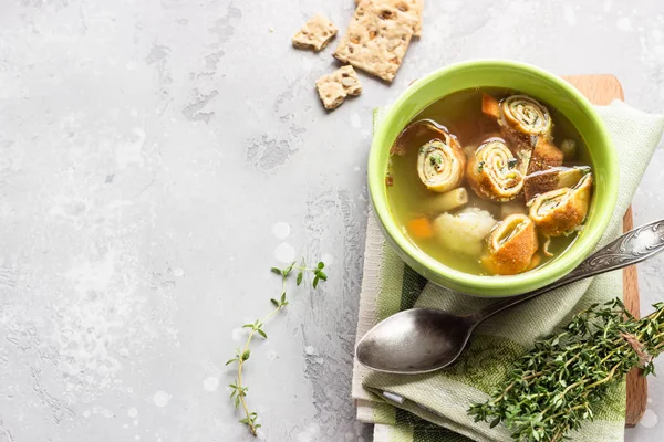 Vegetable soup with egg pancakes on light grey background. Traditional German Flaedlesuppe and Austrian Frittatensuppe. — Stock Image Vegetable Soup Egg Pancakes Light Grey Background Traditional German Flaedlesuppe Stock Photo