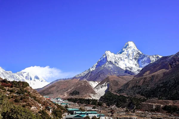 Landscape with the Himalayan mountains in the background on the way to the Everest base camp, Khumbu region in Nepal. Image with copy space. Mountain background. Everest base camp trail.