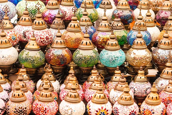 Colorful authentic and traditionally handmade lanterns, chandeliers or mosaic lamps selling on the Turkish Grand Bazaar in Istanbul, Turkey. Turkish or moroccan culture. Handmade lighting.