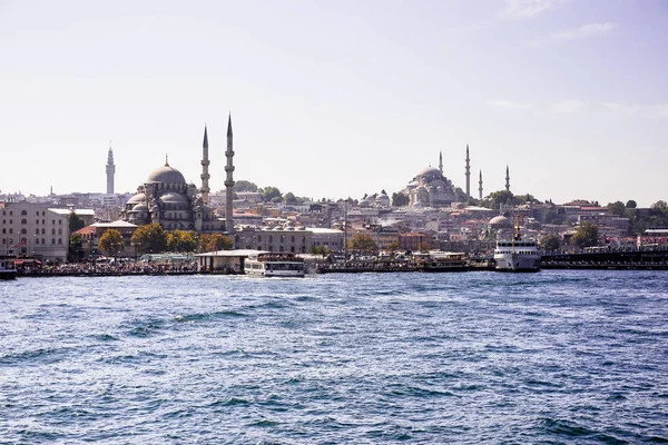 View from the Golden Horn on the historical center of Istanbul. View of the Suleymaniye Mosque, New Mosque, Galata bridge, Eminonu district and square and Balik Ekmek boat shops.