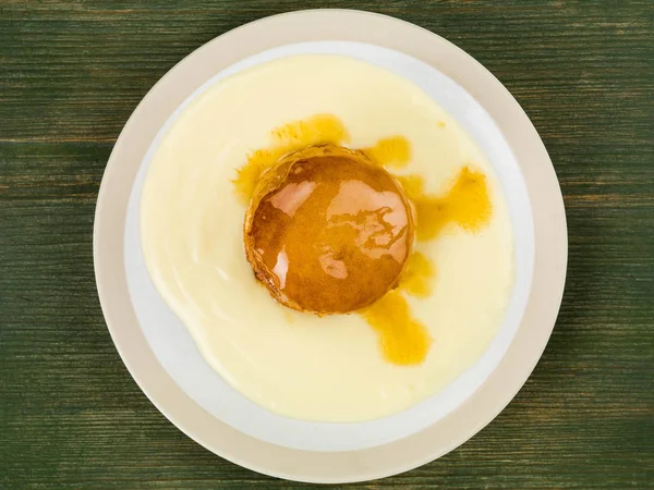 Syrup or Treacle Sponge Pudding With Custard Stock Image