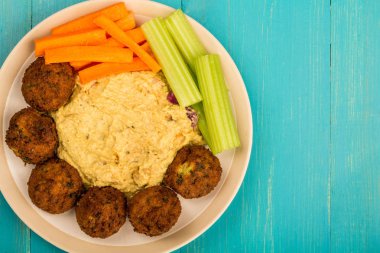 Vegetarian Falafels With Moroccan Style Houmous Carrots and Celery  clipart
