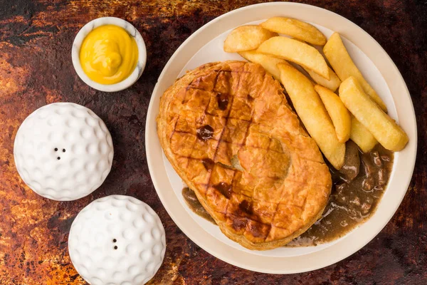 Beef Steak Pie With A Puff Pastry Crust Top And Chips — Stock Photo, Image