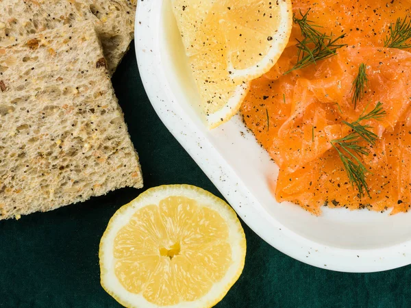 Smoked Salmon With Sliced Brown Bread Pepper and Lemon — Stock Photo, Image