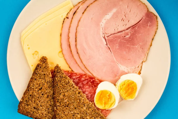 Scandinavian Style Cold meat Breakfast With Rye Bread and a Boiled Egg