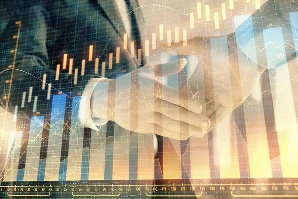 Double exposure of financial graph on cityscape background with two businessman handshake. Concept of stock market deal