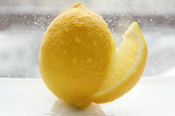 Slice of lemon. Yellow lemon on a white background