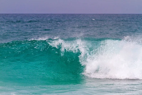 Turquoise Wave Breaks Shore Surfing Seas Oceans — стоковое фото