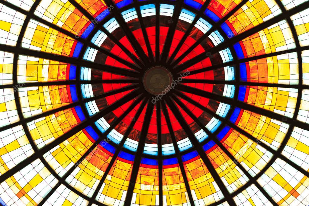 Colored stained glass on a round dome , Arabic style
