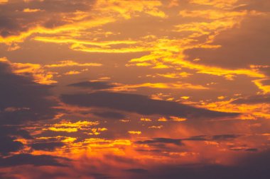 beautiful yellow sunrise among the clouds