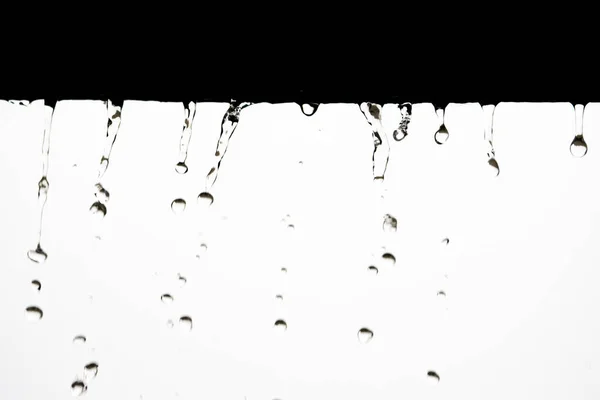 Water fly to the bottom in large drops — Stock Photo, Image