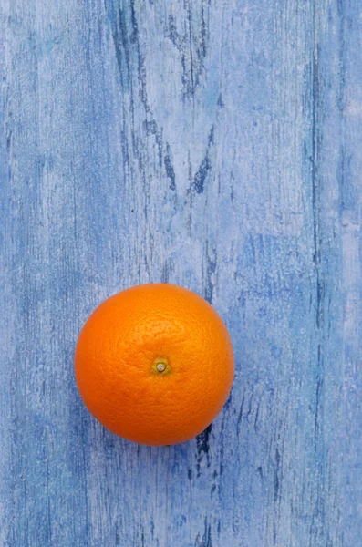 Fresh citrus fruits on an old blue background. Design concept. Selective focus.