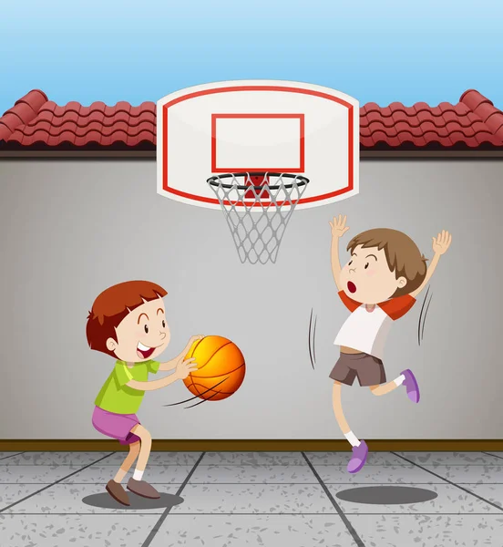 Two boys playing basketball at home