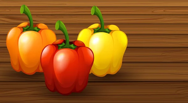 Trois différents poivrons sur fond en bois — Image vectorielle