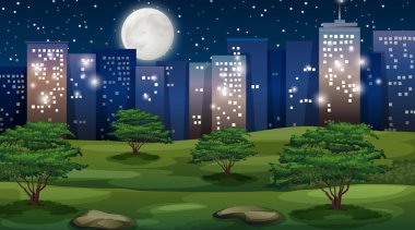 Gece şehir manzarası ve park ön planda