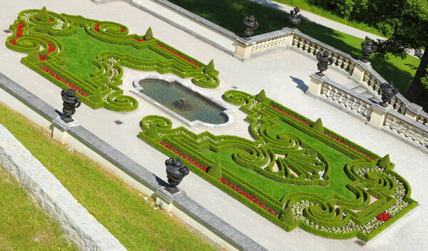 ETTAL, GERMANY - JULY 8, 2016: Carved bushes in garden of Linderhof Palace in southwest Bavaria