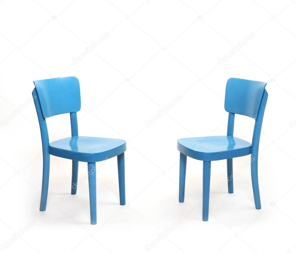 Two classic blue chairs in empty room