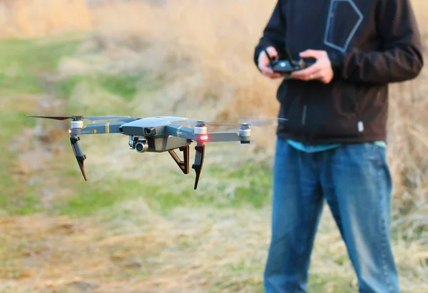 PILSEN CZECH REPUBLIC - MARCH 24, 2017: Unidentified man piloting Drone Dji Mavic Pro with 4K high resolution camera. A quadrocopter with folding arms is powerful photografic tool for traveling.