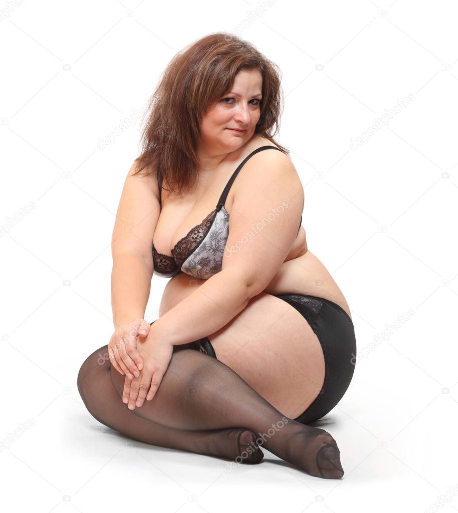 Overweight woman dressed in underwear 