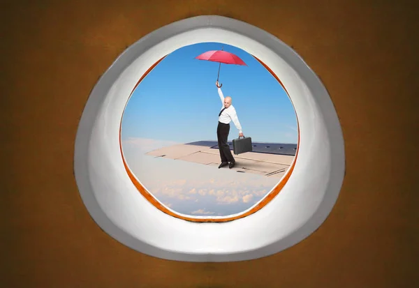 Hilarious View Aircraft Window Passenger Pilot Umbrella Balancing Airliner Wing — Stock Photo, Image