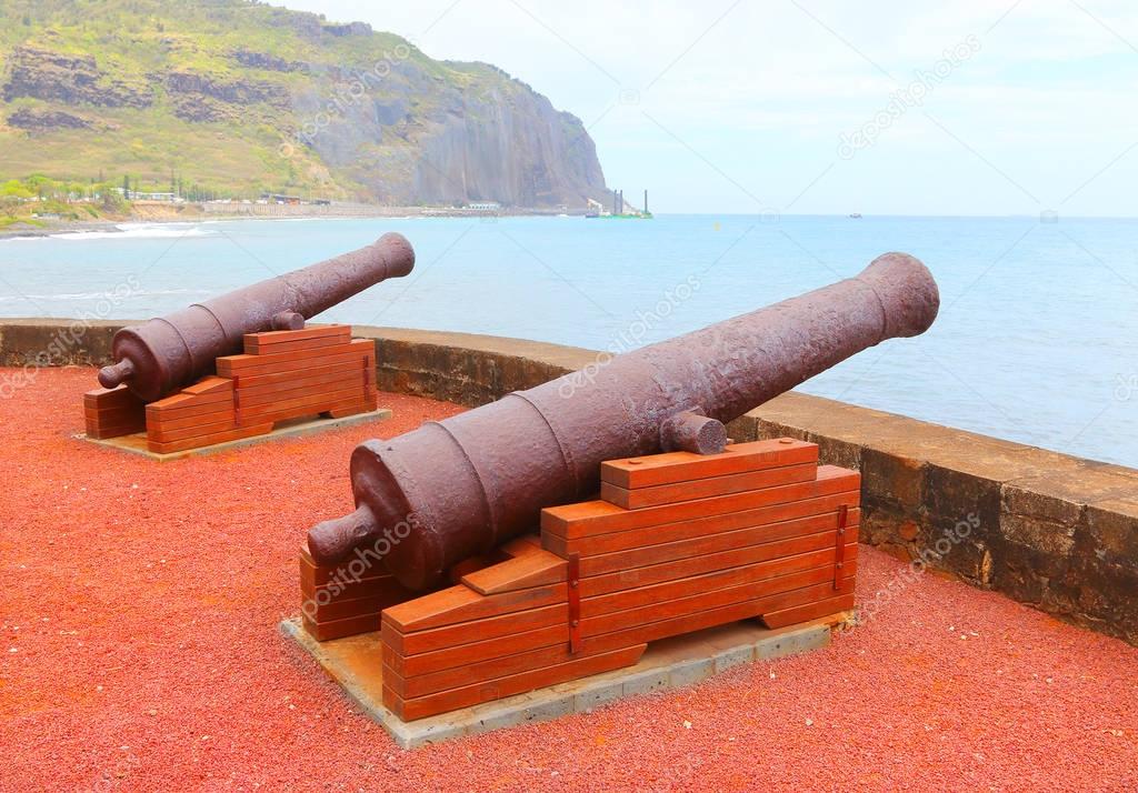 Old navy cannons on waterfront in Saint-Denis