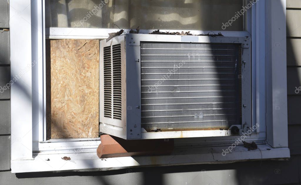 window air conditioner at suburban house